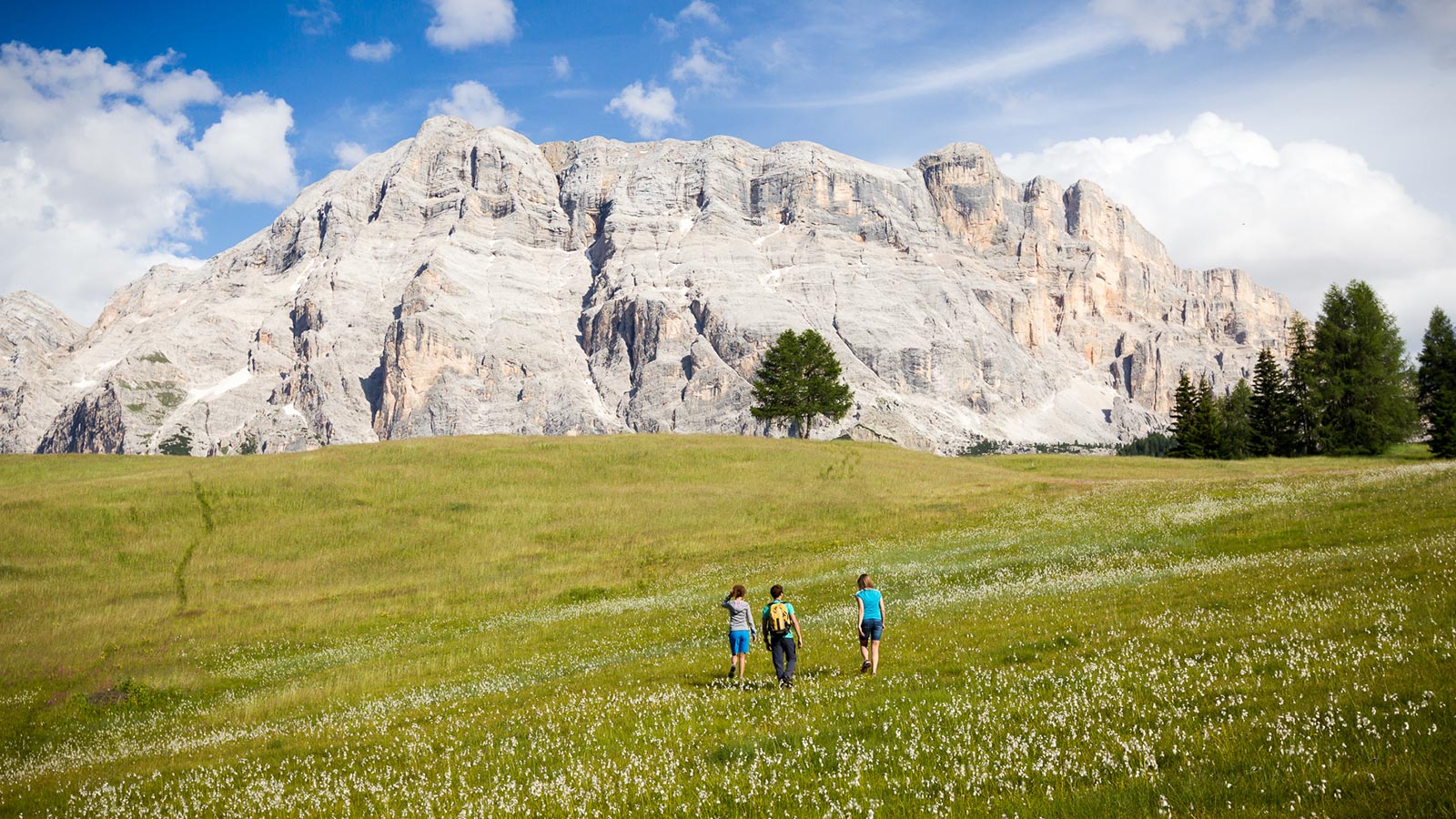 A family on a hike around Hotel Monte Cherz in Passo Campolongo